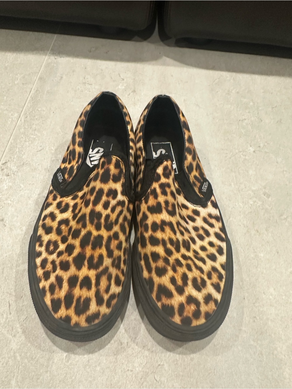 Vans Leopard Print Slip-On Sneakers in Black and Brown